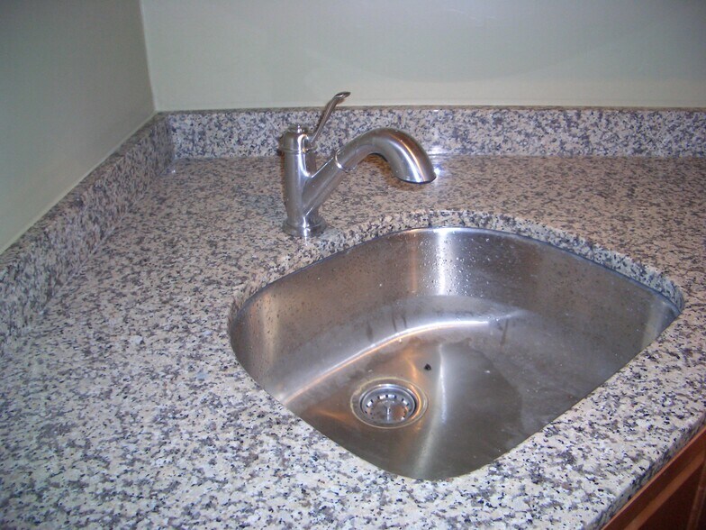 Stainless steel sink with granite countertop - 4121 Davison St