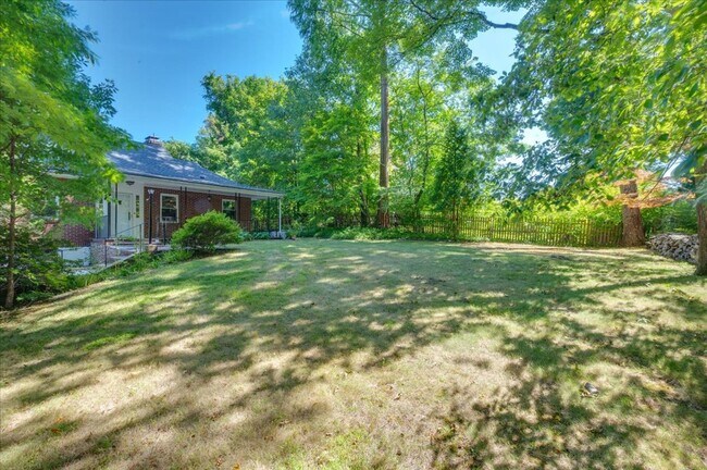 Building Photo - Elegant Multi-Level Brick Residence with Outdoor Oasis