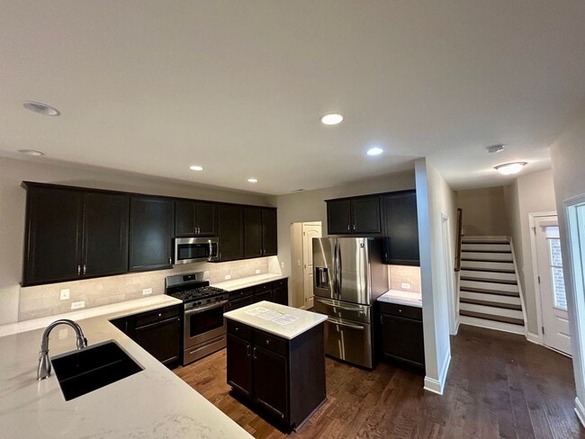 Building Photo - Spacious 3 bed, 3 bath home in Groves Park Commons featuring a modern kitchen, 2-car garage, and ...