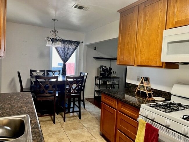 Building Photo - Available Now  4 Bedroom 2 bath home