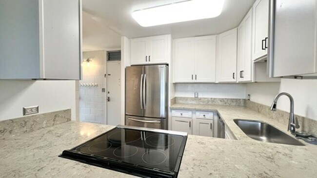 Building Photo - AVAILABLE NOW! Spacious 3-Bedroom, 2-Bath Corner-end Split-level Unit in Kaneohe with 1 Assigned ...