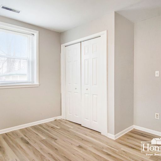 Building Photo - Charming two-bedroom, one-bath home offering a comfortable layout with ample natural light