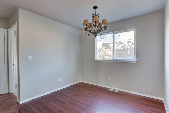 Building Photo - Spacious 4-Bedroom Home with Cozy Backyard...