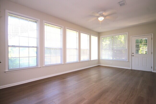 Building Photo - Fully Renovated 3BR/2BA Molino Home on a Spacious Lot Featuring Multiple Living Areas, Sunroom & ...