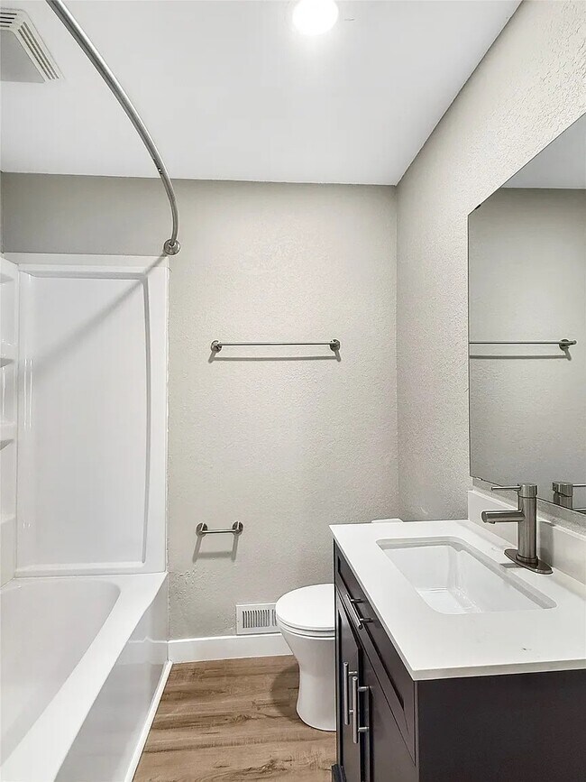 bathroom with tab and shower - 2610 63rd St