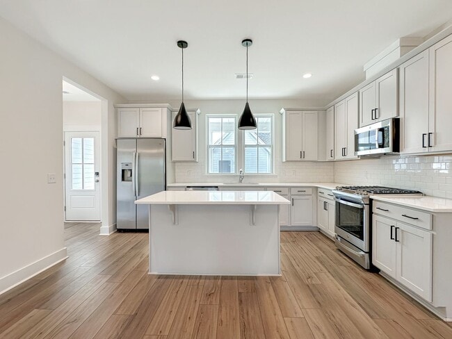 Building Photo - Beautiful, 3-Bedroom Midtown Nexton Townhome with Garage & Amenities