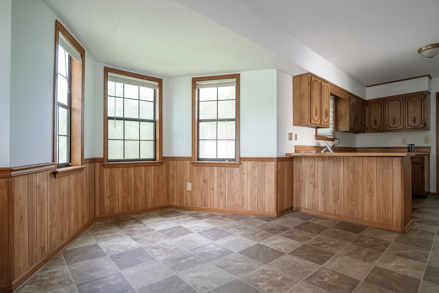 Charming breakfast nook with triple windows and natural light, perfect for morning coffee. - 2313 Salem West Dr