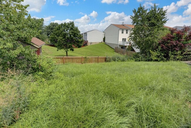 Building Photo - Spacious 4-Level Home with Deck, Workshop ...