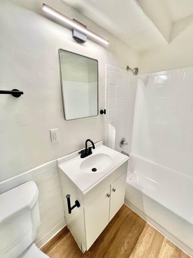 Experience the elegance of a modern bathroom designed for ultimate comfort. - Melody Apartments