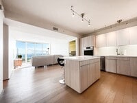 Building Photo - Furnished Symphony Condo with Direct Ocean Views and Two Parking