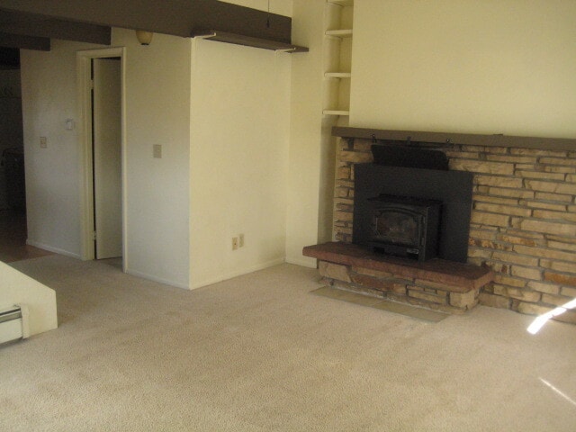 Living room with wood burning stove - 554 Cartier Ct