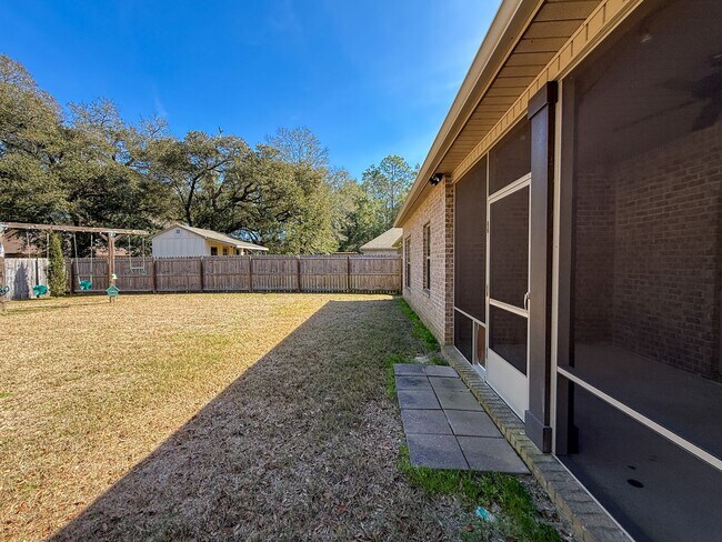 Building Photo - Spacious 3 Bedroom 2 Bath + Office with Split Floor Plan & Screened Patio in Pace!