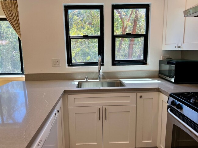 Building Photo - Great Natural light, Treetop Views with 2 Primary Suites plus OFFICE and a 2 car garage, It is li...