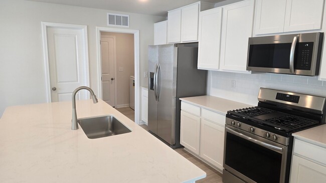 Building Photo - New Home with 5BR/2.5BA, Loft Area, Primar...