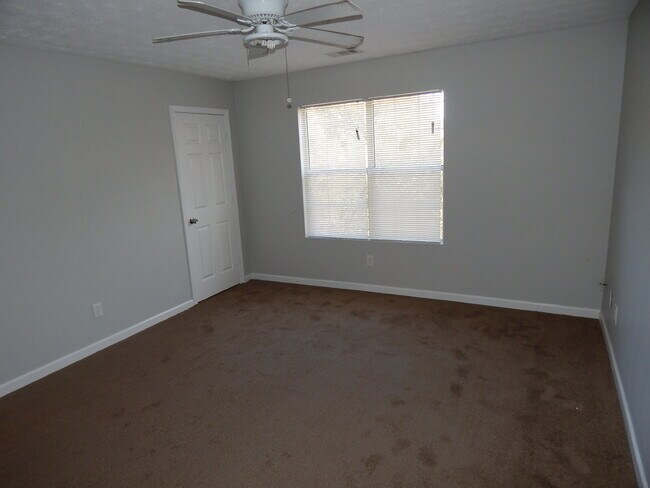 Building Photo - Freshly painted and new flooring in this 4 Bedroom 2 and Half Bath home. Covered front porch with...