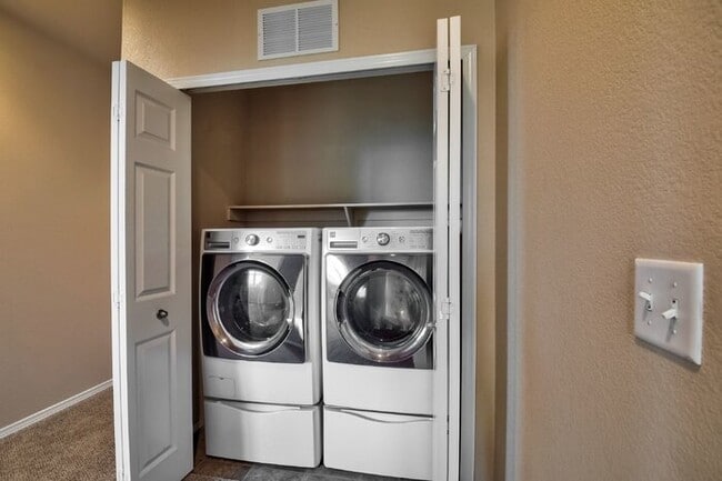 Building Photo - Immaculate 3-Bedroom Townhome with Stainless Steel Appliances and Attached Garage Near Peterson SFB