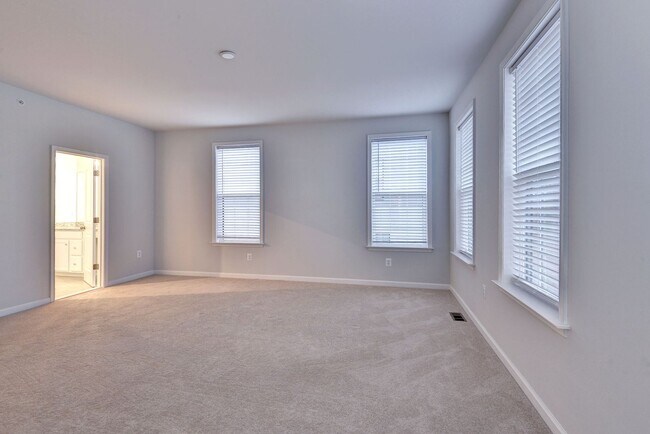 Building Photo - Three Story Brick End Unit with Rooftop Terrace