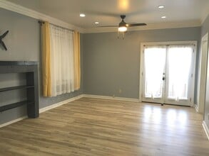 Building Photo - Midtown 2 story condo. Over 1200 sq ft of living space! Fenced in back yard! Pets are owner's app...