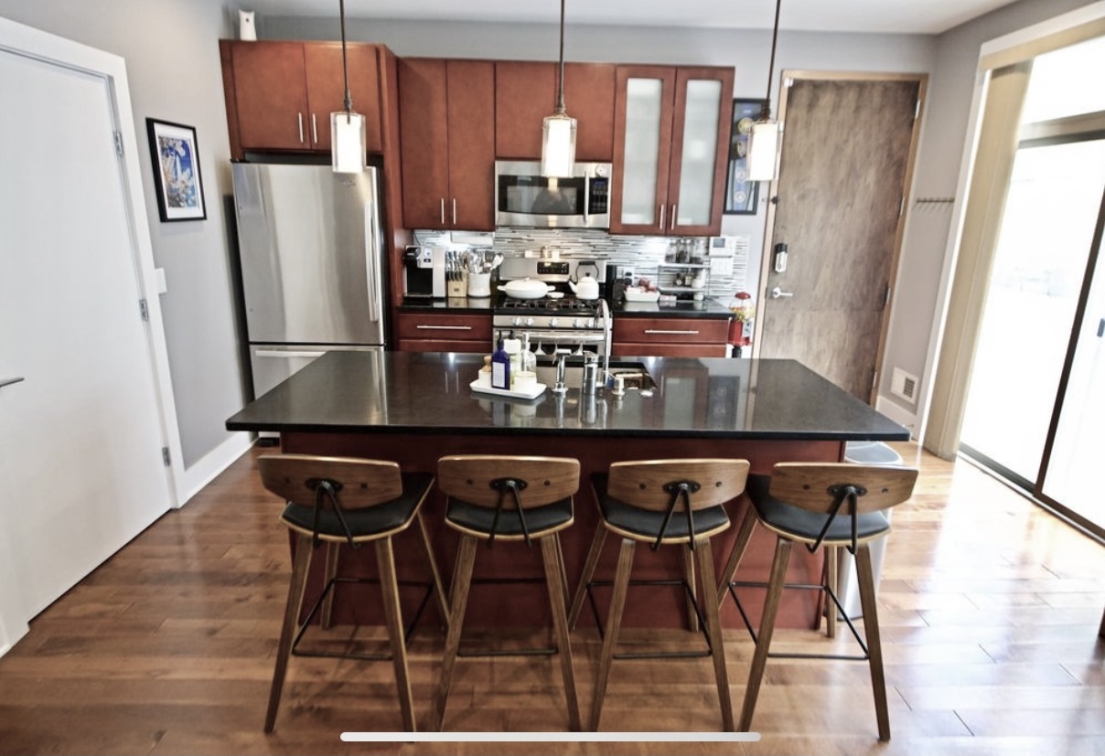 Sliding door off the kitchen to access enormous deck. - 1535 North Philip Street
