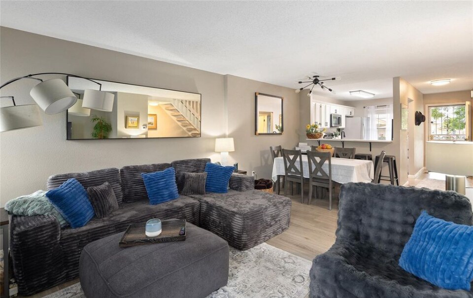 Living room into kitchen - 10587 W Maplewood Dr