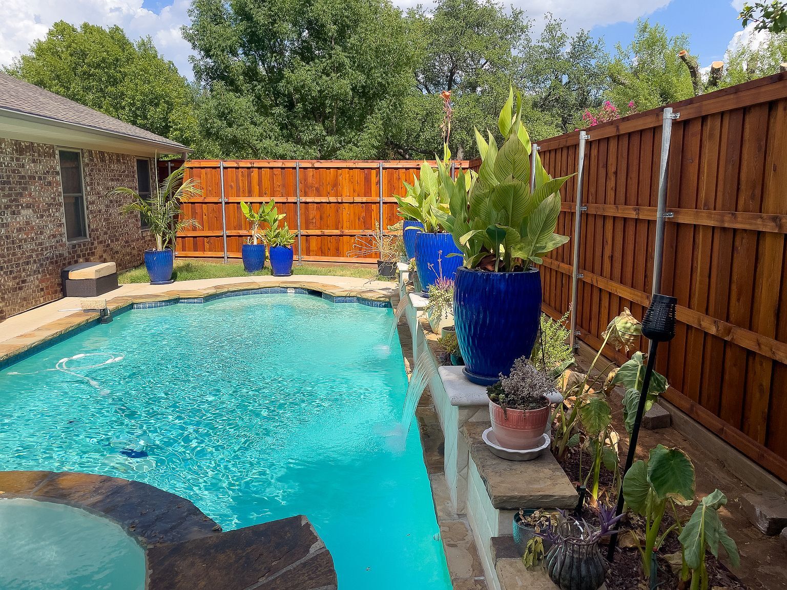 Backyard pool and spa area with cedar pergola and cedar fence - 2006 Candle Ct
