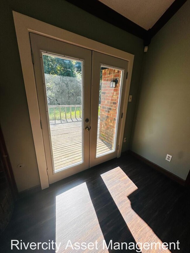 Building Photo - charming three-bedroom, two-full-bath resi...