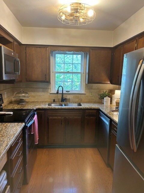 Kitchen with microwave and LG french door fridge - 116 Cambridge Place Dr