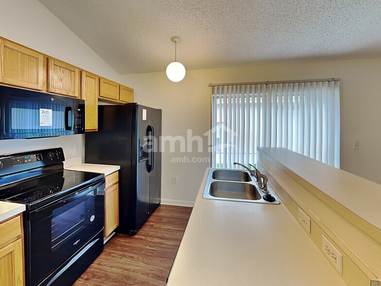 Building Photo - 6544 Gentle Oaks Dr S