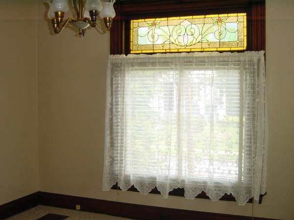 Original stained glass window in the bedroom - 105 Maple Ave