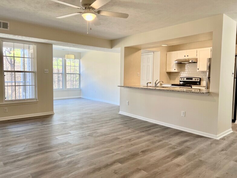 Open floor plan: Family room, sun room, kitchen - 9373 Manowar Ct