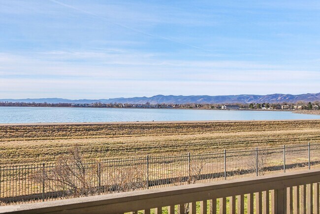 Building Photo - Backs to private lake with mountain views