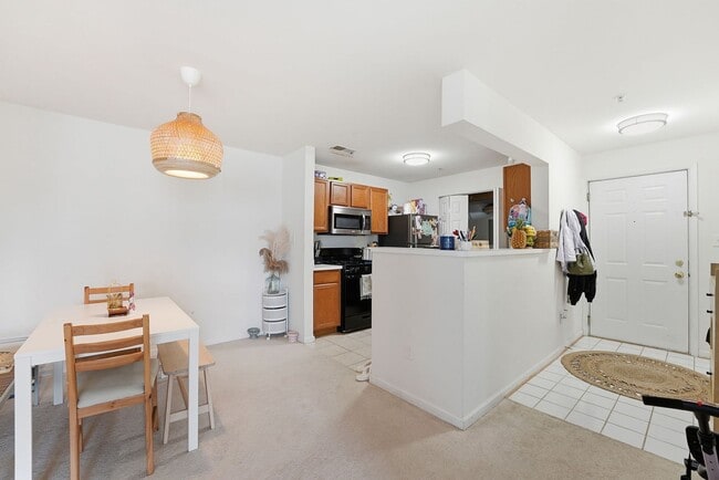 Building Photo - Bathed in natural light, this stunning second level condominium offers an effortless blend of com...