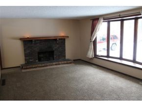 living room with fireplace and large picture window - 1305 E Grandview