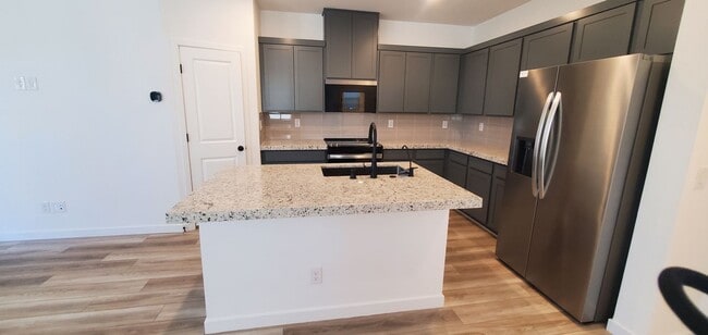 Building Photo - Beautifully designed modern townhome with attached garage.