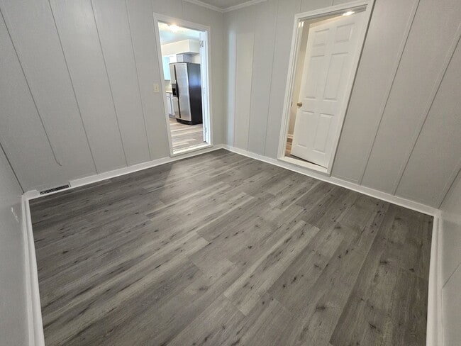 Building Photo - 3/2 with Fenced Yard; In-town and Near an ...