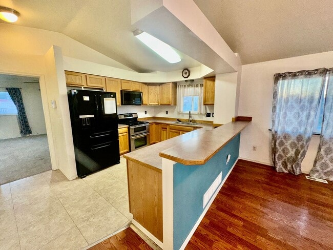 Building Photo - Check out the private fenced backyard!