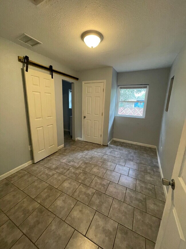 Building Photo - Open floor plan, four-bedroom two-bathroom with washer and dryer