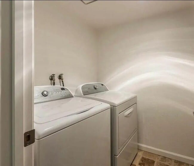 Building Photo - Beautiful 2-Bedroom Condo with Serene Water Views and Modern Amenities