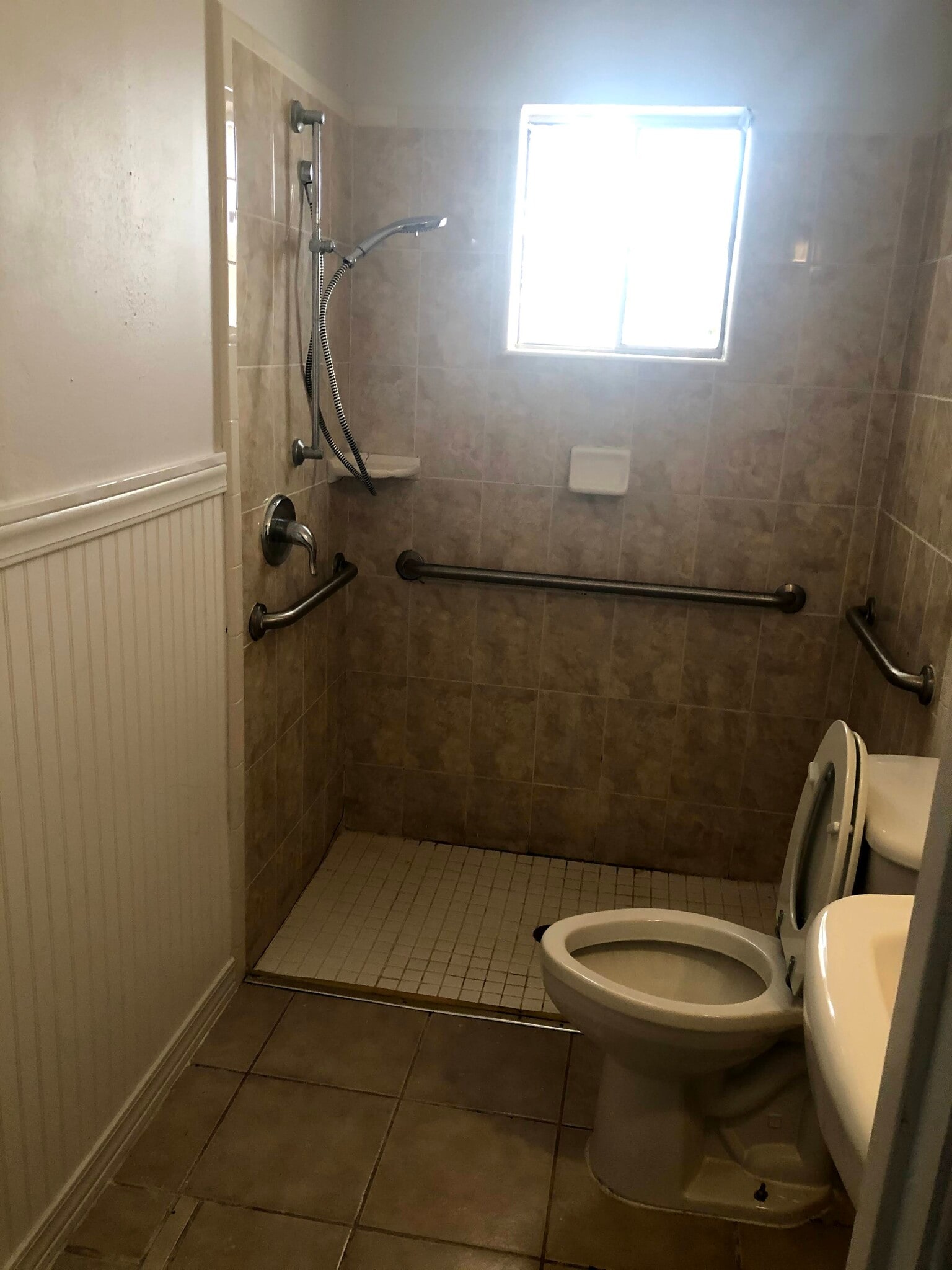 Handicap Accessible bathroom with grab bars. - 601 E Williamson Ave