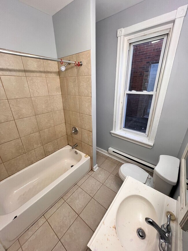Building Photo - Updated 3 Bedroom 1.5 Bath Townhome w/ Paved Yard + Washer & Dryer