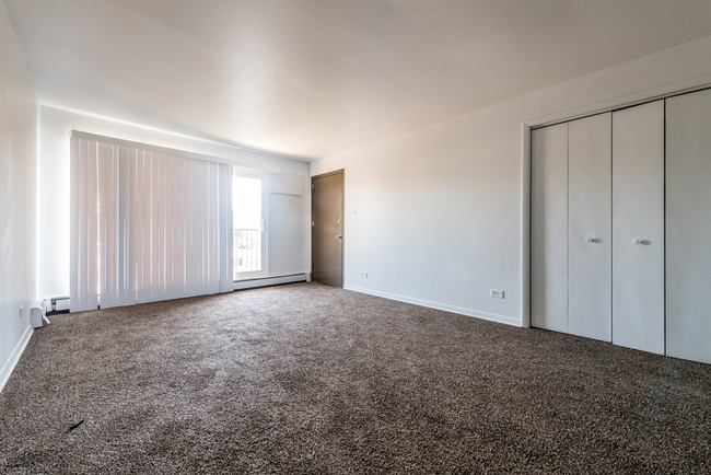 Enjoy a spacious living room as you enter your new apartment home. - 1121 W 127th St