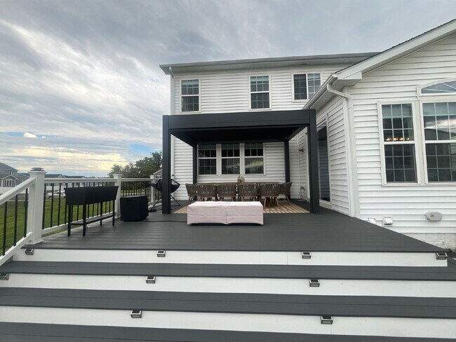 Building Photo - Stunning 5-Bedroom Custom Home with Solar, EV Charging & Private Media Room