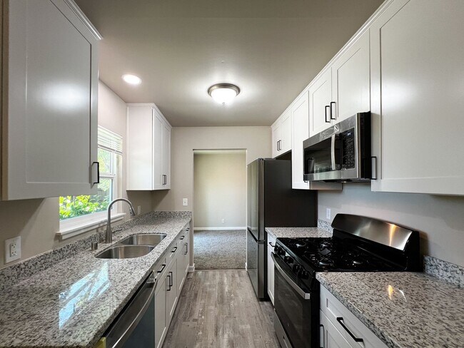 Building Photo - Freshly Renovated 3 Bedroom Home with Large Fenced Yard & Double Garage