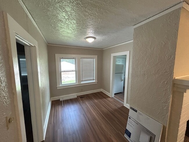 Building Photo - Freshly Painted 2x1 with Brand-New Plank Floors