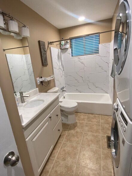 New bathtub tile and marble vanity top - 3413 Lisa Dr