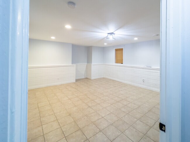 Downstairs living room area - 605 Ruxton Ridge Dr