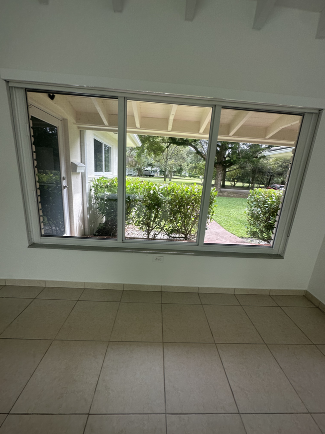 View of Entryway and park from living room - 5400 Orduna Dr