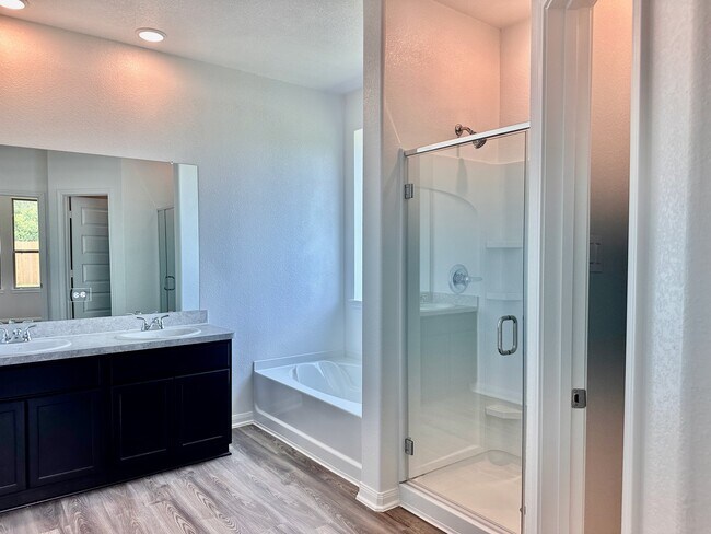 The primary bathroom is large and features double sinks and storage! - 730 Tejas Village Pky