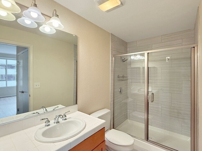 Building Photo - Newly Remodeled 2B/2BA condo w/ Reserved P...