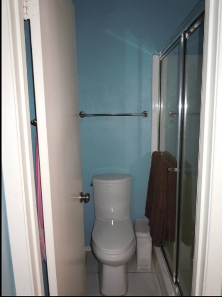 Attached bath in main bedroom has a shower. Upstairs bath has tub/shower. - 6806 Thorncliffe Dr